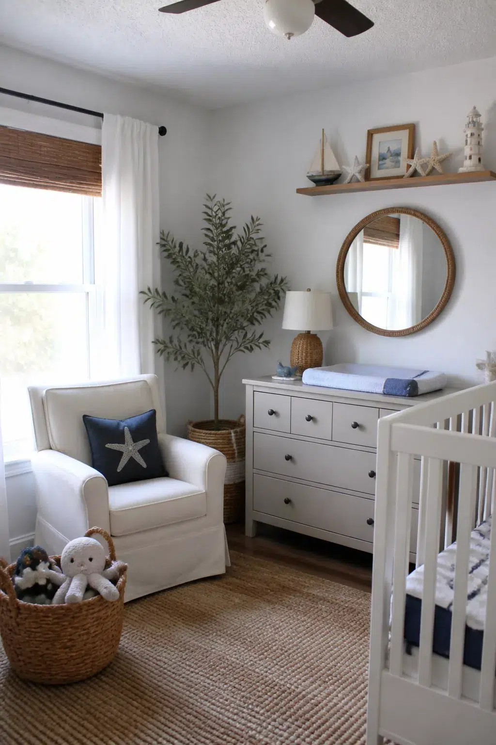 Coastal beach themed nursery designs with rattan mirror, floating shelf, starfish decor, and white glider chair