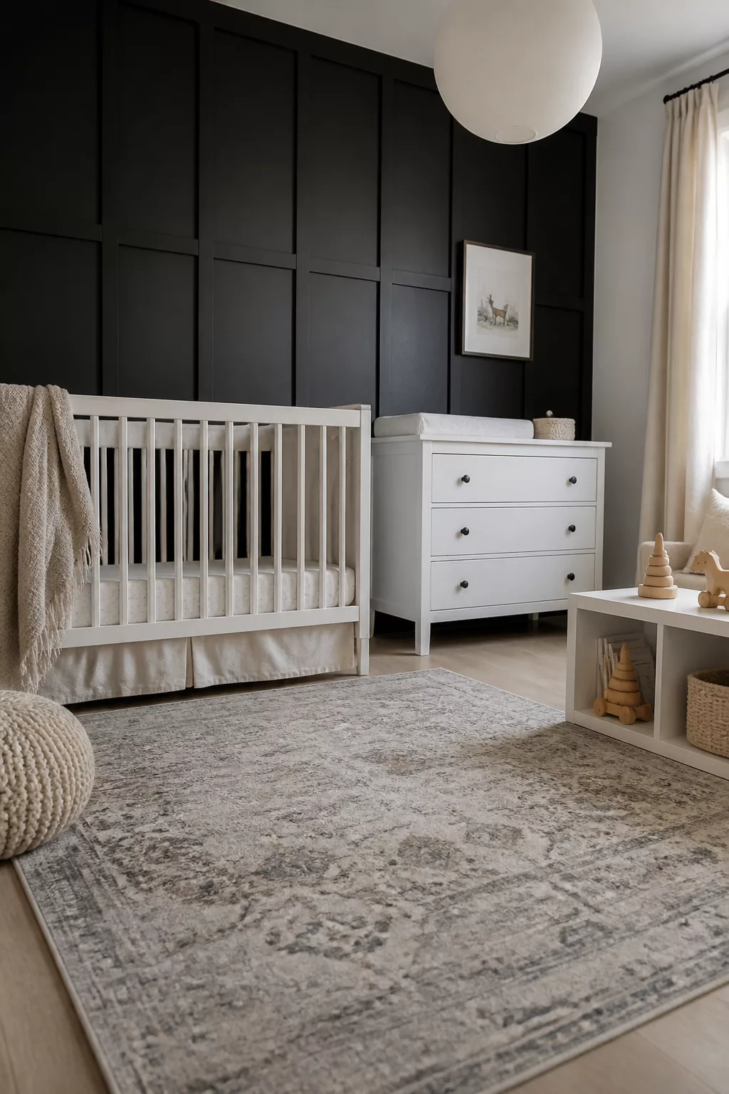 Black matte board and batten nursery wall with grid paneling, white crib, and dresser in a modern baby room.