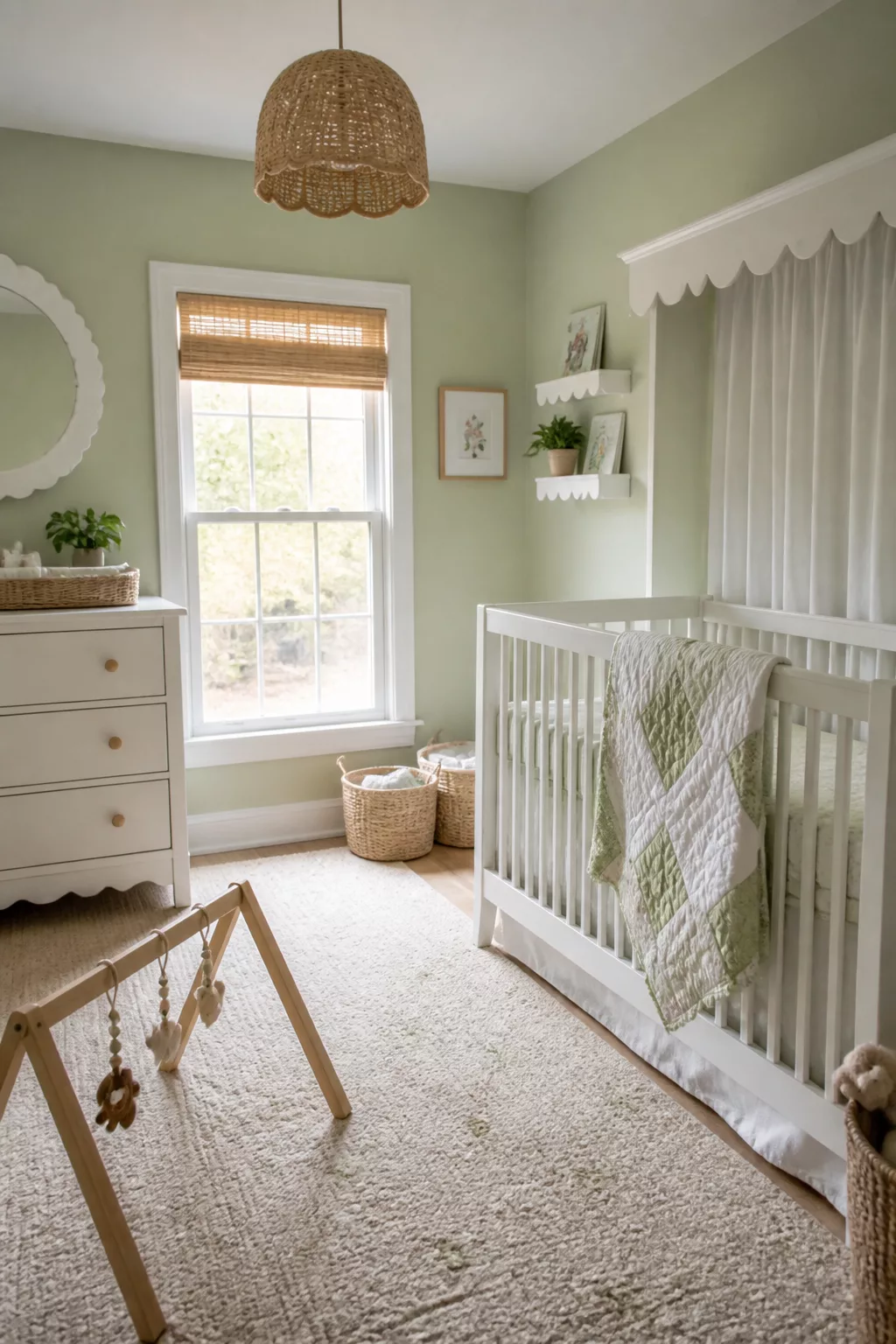 Pistachio green and white nursery designs with scallop trim valance, woven pendant, and white crib.