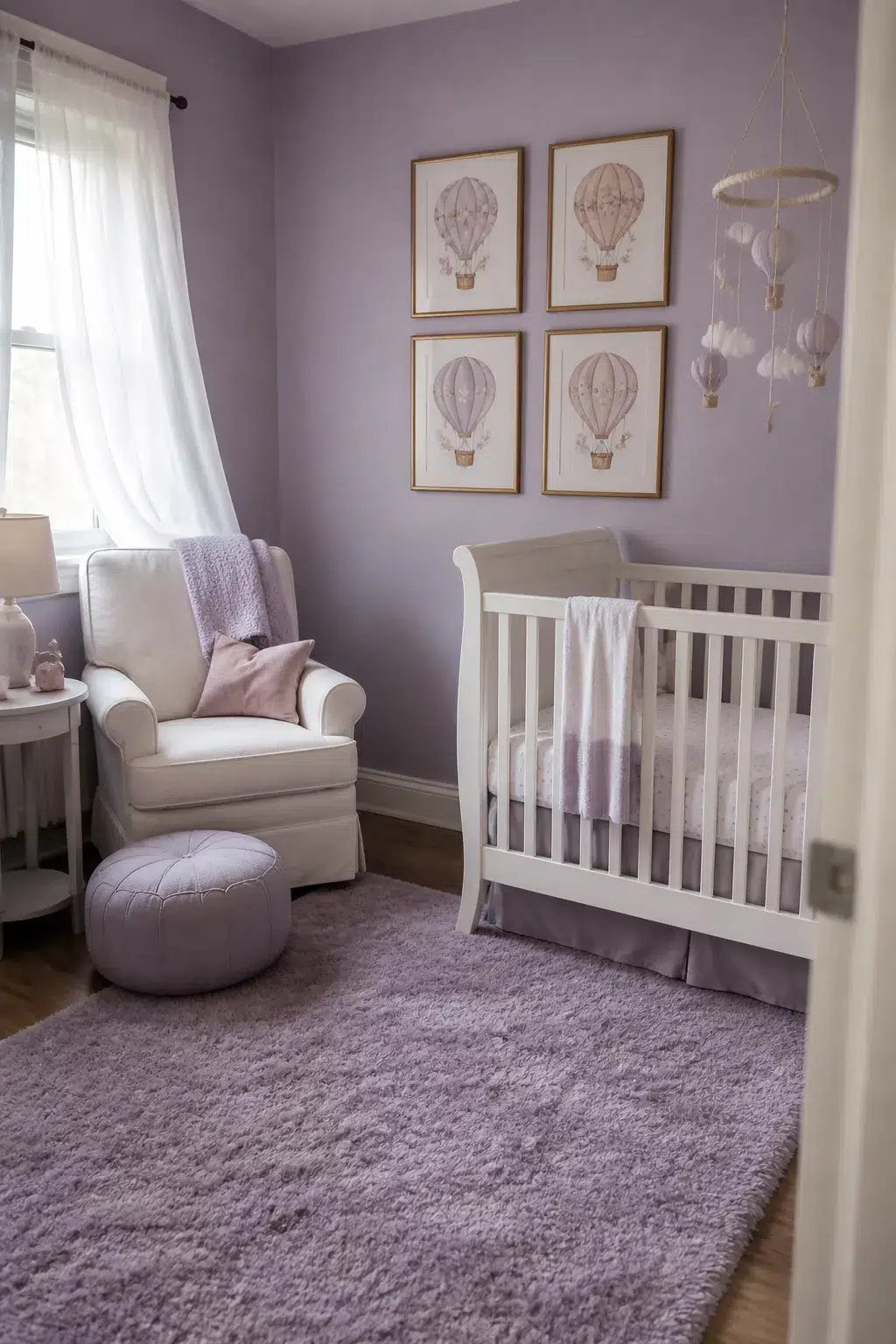Lavender hot air balloon nursery ideas with framed prints, fluffy rug, white crib, and glider chair
