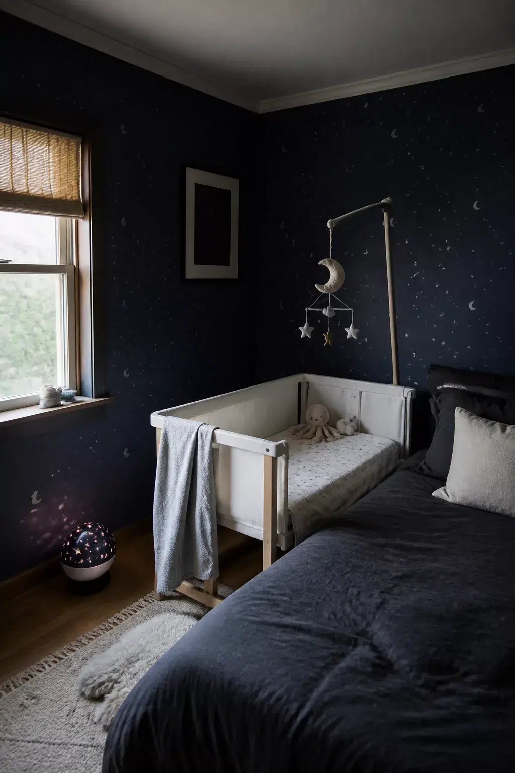 Dark navy star wallpaper bedside crib small room nursery ideas with felt moon mobile and star projector